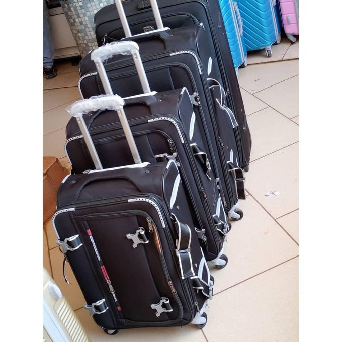A Set Of 4 In 1 Cloth Suitcase With Different Sizes It's Black In Colour Durable Strong It Has Multiple Colours Extremely Durability